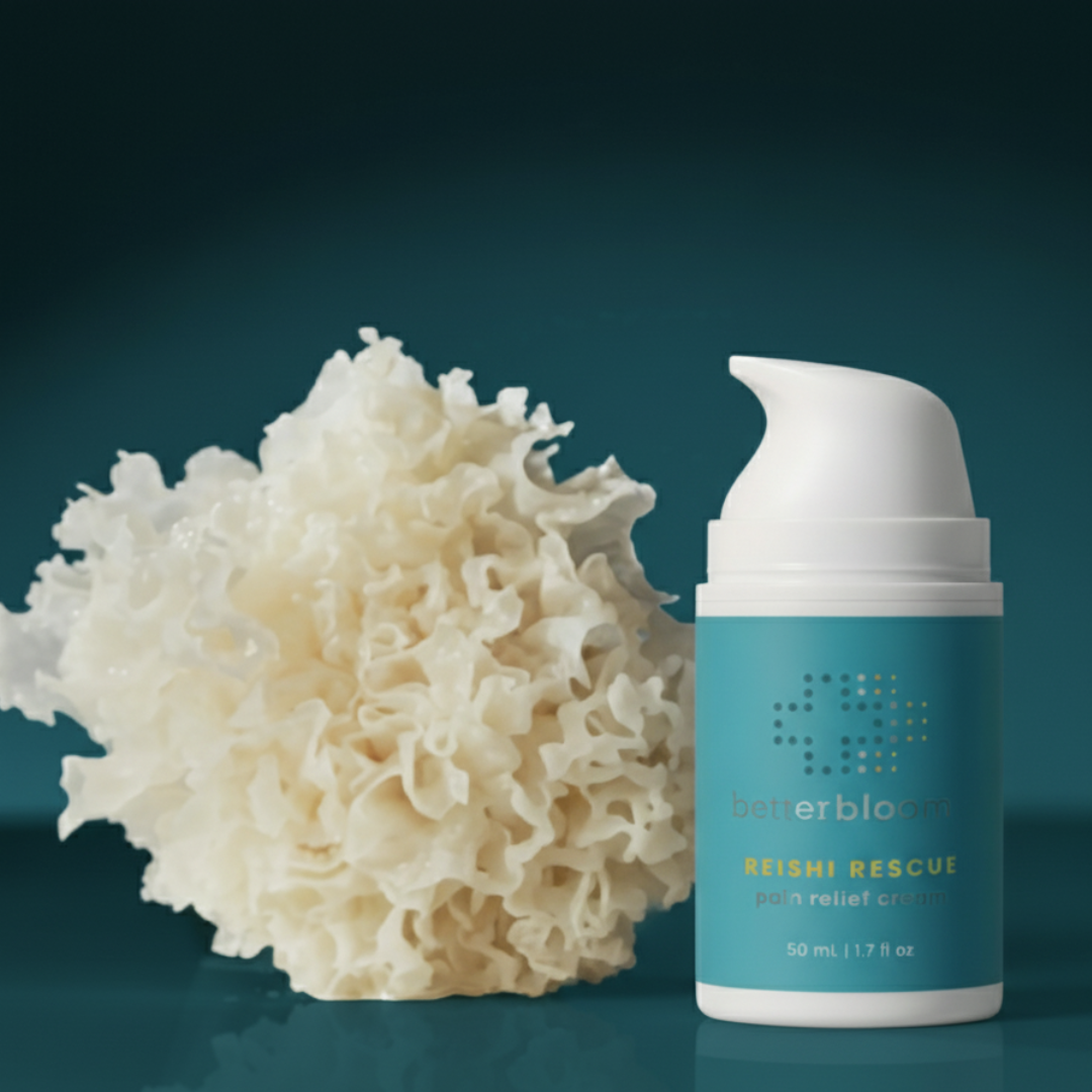 Blue bottle of Reishi Rescue cream next to tremella mushroom on a dark blue background